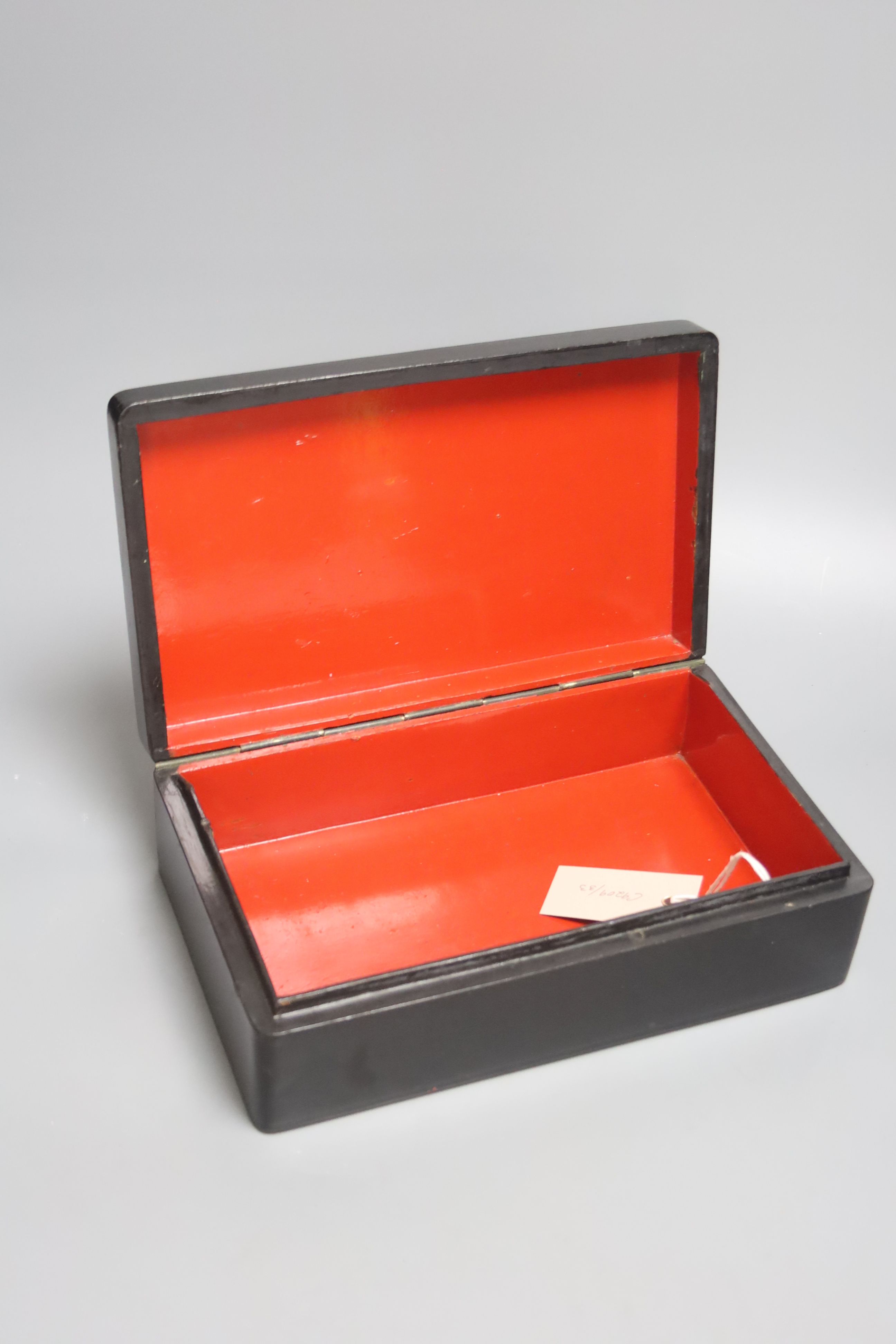 A 19th century Russian lacquer box, decorated with dancers to the cover, and signed lower left, 29 x 18cm